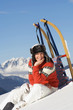 Woman in mountains with sledge