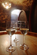 Wite wine in glasses on wine cask
