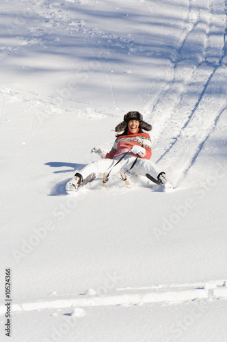 Photo: Woman tobogganing in mountains Woman tobogganing in mountains