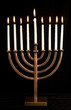 Photo: Beautiful lit hanukkah menorah on black velvet. Beautiful lit hanukkah menorah on black velvet.