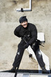 SWAT Team Officer Rappelling from Building