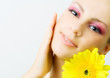 Young woman with gerbera flower.