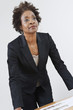 Businesswoman Leaning on Table
