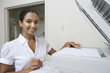 Woman Using Photocopier