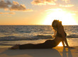 forty year old woman doing yoga at sunrise on the beach forty year old woman doing yoga at sunrise on the beach