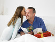	Man looking at card with daughter
