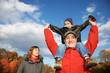 Happy family in autumn park