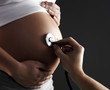 Foto: pregnant woman being examined by a doctor pregnant woman being examined by a doctor