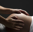 Loving Hands on a pregnant tummy