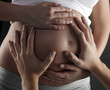 Loving Hands on a pregnant tummy