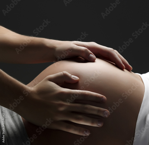 Loving Hands on a pregnant tummy