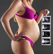 pregnant woman carrying her child's ultrasound picture
