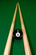american pool balls on geen snooker table.