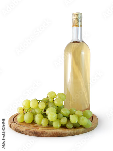 Photo: bottle of white wine and a bunch of grapes on white background bottle of white wine and a bunch of grapes on white background