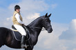young woman and black horse
