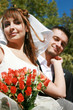 Young couple and wedding bouquet