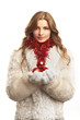 Young beautiful woman in white fur coat with red balls Young beautiful woman in white fur coat with red balls