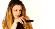 Young woman holding a remote control