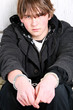 teen crime - boy with handcuffs portrait teen crime - boy with handcuffs portrait