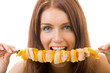 Portrait of young happy woman eating shish kebab, isolated Portrait of young happy woman eating shish kebab, isolated