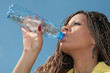 black african girl drinks a water