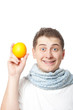 young adult man holding orange