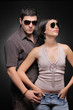 Foto: Fashionable couple against black background Fashionable couple against black background