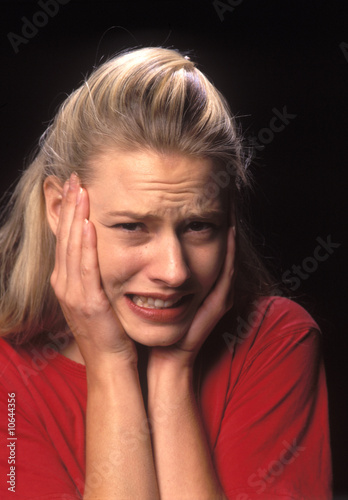 Photo: A young woman filled with fear and stress A young woman filled with fear and stress