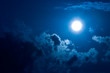 moon in darkness on a background of sky and clouds