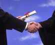 presentation of a diploma and a handshake at graduation presentation of a diploma and a handshake at graduation