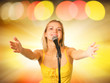 Beautiful young singer on abstract background