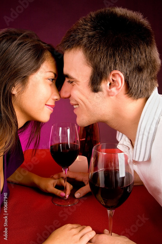 Photo: Couple Getting Closer While Having Wine Couple Getting Closer While Having Wine