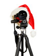 Digital photo camera in a santa clause cap Digital photo camera in a santa clause cap