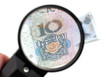 Chinese yuan banknote through a magnifier Chinese yuan banknote through a magnifier