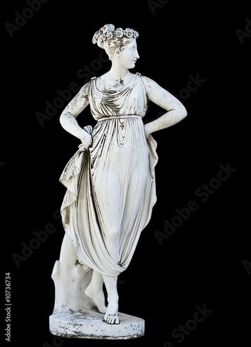 Photo: Statue on black background showing a greek mythical muse Statue on black background showing a greek mythical muse