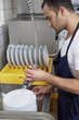 man washing dishes.