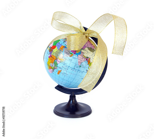 Photo: World globe and golden ribbon World globe and golden ribbon