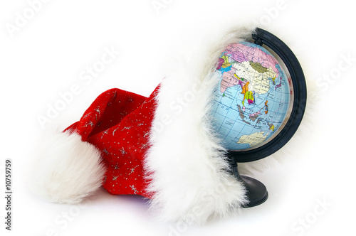 Photo: World globe and Santa Claus hat World globe and Santa Claus hat
