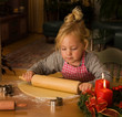 A child at Christmas in Advent when baking cookies