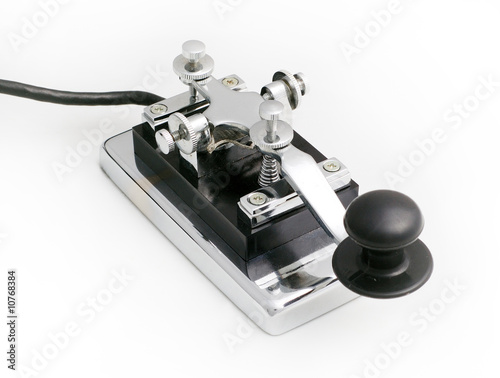 Photo: vintage morse telegraph key with white background vintage morse telegraph key with white background