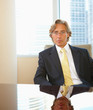 Mature business person sitting on chair in office