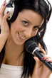 top view of smiling woman posing with headphone and microphone