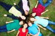 Foto: Young girls and boys lying on ground in a circle Young girls and boys lying on ground in a circle