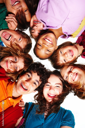 Photo: Happy small boys and girls standing in a circle Happy small boys and girls standing in a circle
