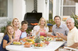 Family Enjoying A Barbeque