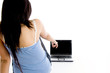 brunette female student pointing to notebook