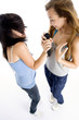 young girls performing with microphone