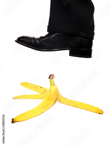 Photo: business shoe steping a banana business shoe steping a banana