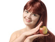 Beautiful young woman holding fresh apple, isolated over white