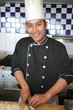 chef cooking and smiling